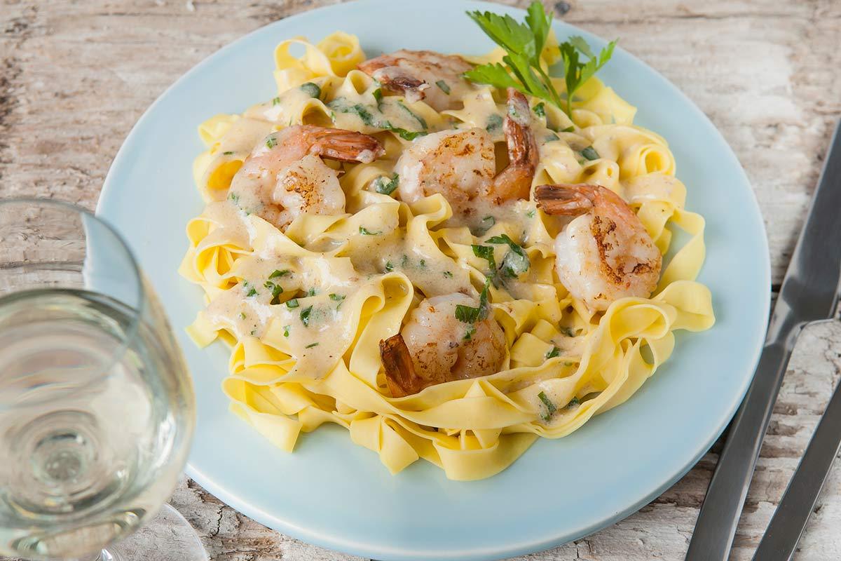 Pasta met knoflook roomsaus & witvis met spinazie